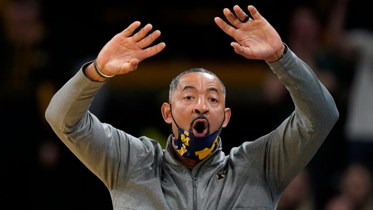 Michigan head coach Juwan Howard directs his team during the first half of an NCAA college basketball game against Iowa, Thursday, Feb. 17, 2022, in Iowa City, Iowa. Michigan won 84-79. (AP Photo/Charlie Neibergall)