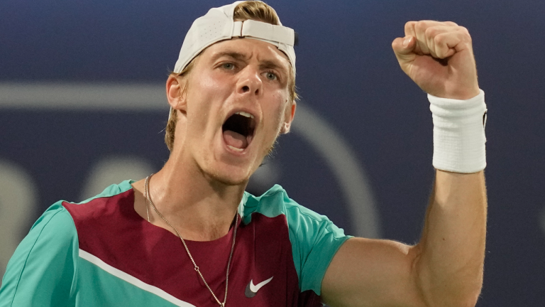 Canada's Denis Shapovalov celebrates after he won the first set against Lithuania's Ricardas Berankis during a quarterfinal match of the Dubai Duty Free Tennis Championship in Dubai, United Arab Emirates, Thursday, Feb. 24, 2022. (AP)