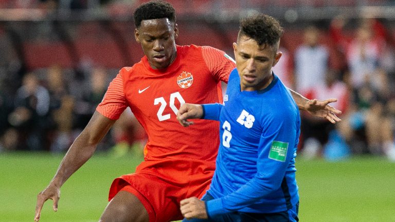 Canada's Jonathan David (left) battles for the ball with El Salvador's Narciso Orellana during first half World Cup qualifying action in Toronto, on Wednesday, September 8, 2021. (Chris Young/CP)