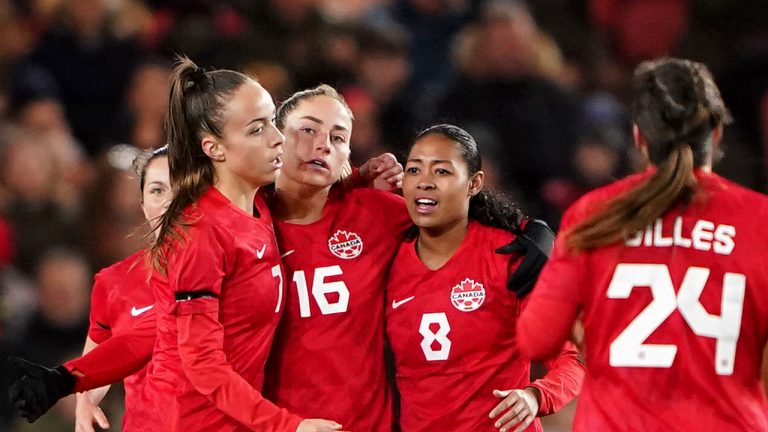 Canada's Janine Beckie, number 16, celebrates with teammates after scoring her side's first goal during the Arnold Clark Cup women's soccer match between England and Canada, at the Riverside Stadium, Middlesbrough, England, Thursday, Feb. 17, 2022. (Zac Goodwin/PA via AP)