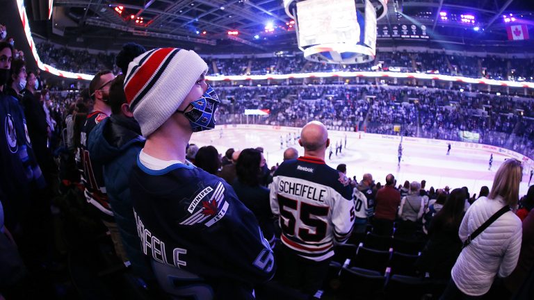 Winnipeg Jets fans take in first period NHL action against the Minnesota Wild in Winnipeg as they return to 100 per cent capacity for home games at Canada Life Centre. (John Woods/CP)