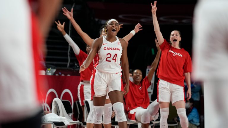 Canada players celebrate scoring by a teammate during women's basketball preliminary round game against Spain at the 2020 Summer Olympics, Sunday, Aug. 1, 2021, in Saitama, Japan. (Eric Gay/AP)