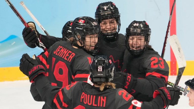 Team Canada players Brianne Jenner (19), Marie-Philip Poulin (29) and Erin Ambrose (23) celebrate a goal against Sweden during first period women's quarter-final round hockey action at the Beijing Winter Olympics in Beijing, China, on Friday, Feb. 11, 2022. (Ryan Remiorz/THE CANADIAN PRESS)