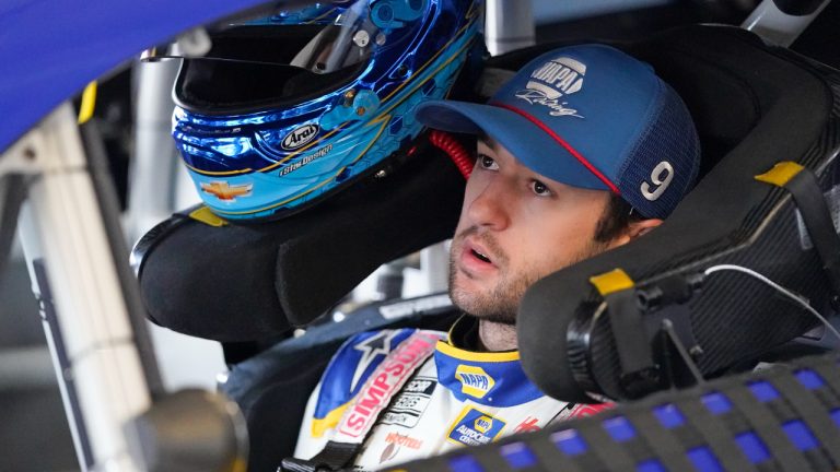 Chase Elliott gets ready to exit his car in his garage during practice for the Daytona 500 auto race at Daytona International Speedway, Saturday, Feb. 19, 2022, in Daytona Beach, Fla.. (AP)