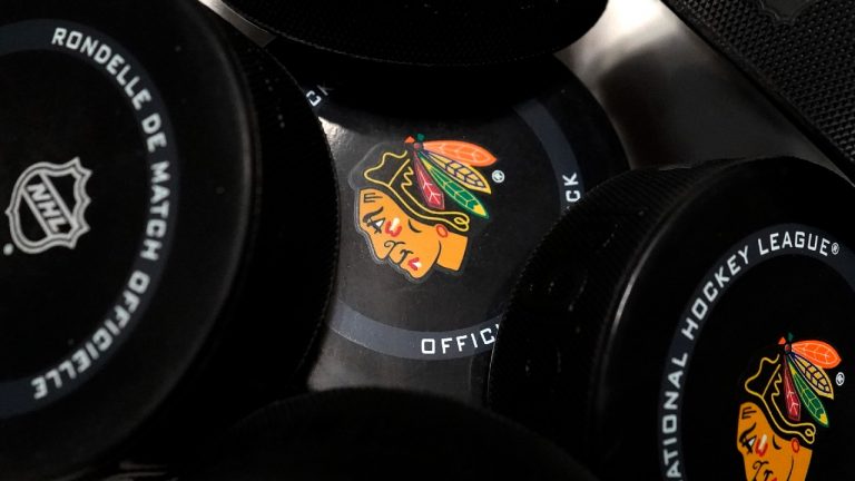 NHL hockey pucks are viewed before an NHL hockey game between the Minnesota Wild and the Chicago Blackhawks. (Nam Y. Huh/AP)