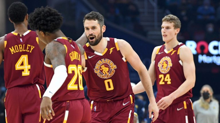 Cleveland Cavaliers' Kevin Love (0) celebrates with Brandon Goodwin (26) in the first half of an NBA basketball game against the Indiana Pacers, Sunday, Jan. 2, 2022, in Cleveland. (Nick Cammett/AP)