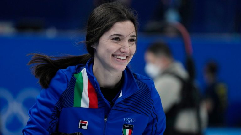 Italy's Stefania Constantini smiles after winning the mixed doubles match against Norway, at the 2022 Winter Olympics, Friday, Feb. 4, 2022, in Beijing. (Nariman El-Mofty/AP Photo)