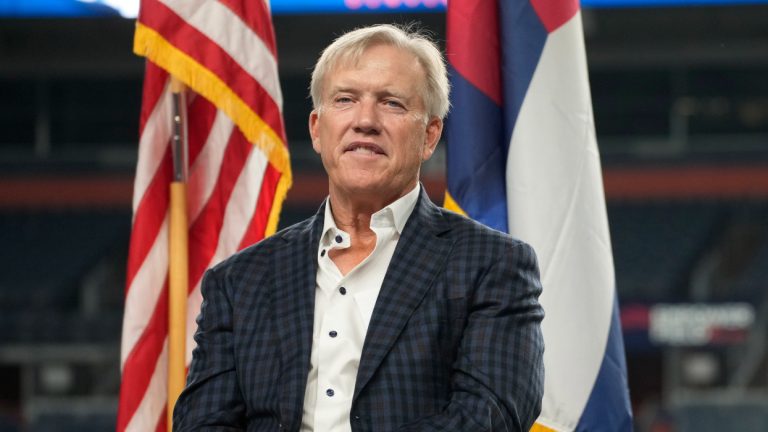 John Elway, president of football operations for the Denver Broncos, during a memorial service to mark the 20th anniversary of the Sept. 11 terror attacks on the United States on Wednesday, Sept. 1, 2021, in Empower Field at Mile High in Denver. (AP Photo/David Zalubowski)