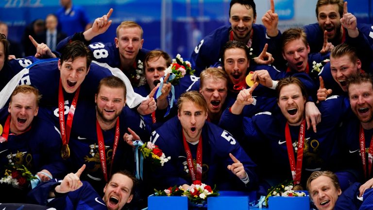 Finland players celebrate after defeating Russian Olympic Committee in the men's gold medal hockey game at the 2022 Winter Olympics, Sunday, Feb. 20, 2022, in Beijing. (Matt Slocum/AP Photo)