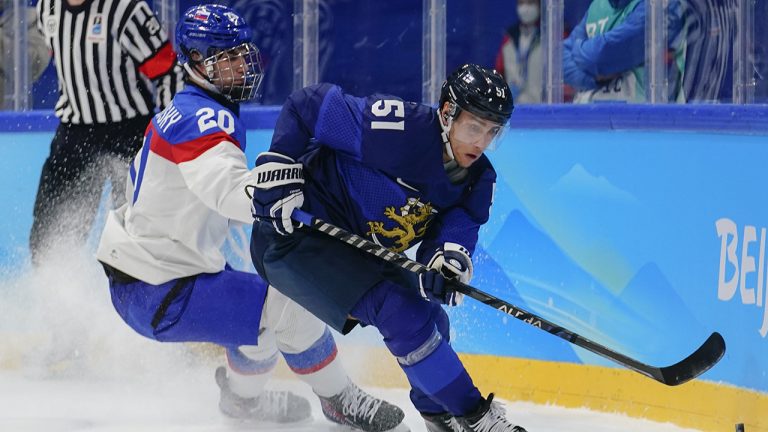 Slovakia's Juraj Slafkovsky (20) chases Finland's Valtteri Filppula (51) during a men's semifinal hockey game at the 2022 Winter Olympics. (Matt Slocum/AP)