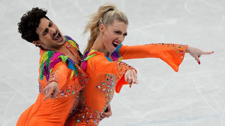 Piper Gilles and Paul Poirier, of Canada, perform their routine in the ice dance competition during figure skating at the 2022 Winter Olympics, Saturday, Feb. 12, 2022, in Beijing. (David J. Phillip/AP Photo)