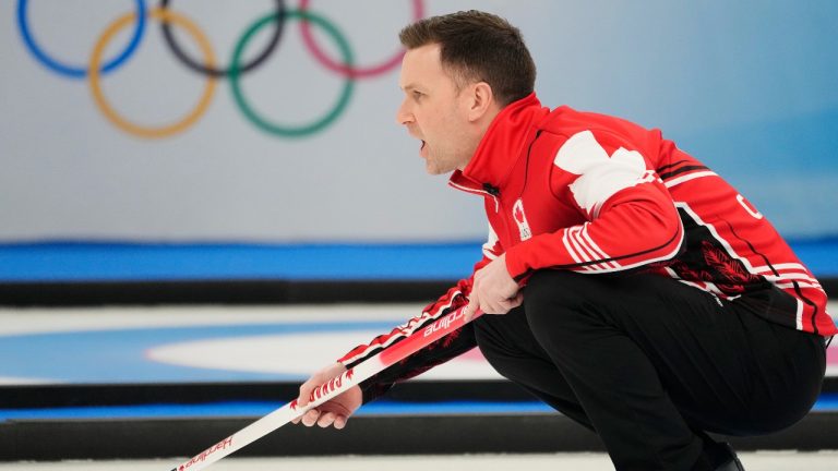 Canada skip Brad Gushue calls to his sweepers during men's bronze medal curling action against the United States at the 2022 Winter Olympics in Beijing on Friday, Feb. 18, 2022. (Ryan Remiorz/THE CANADIAN PRESS)