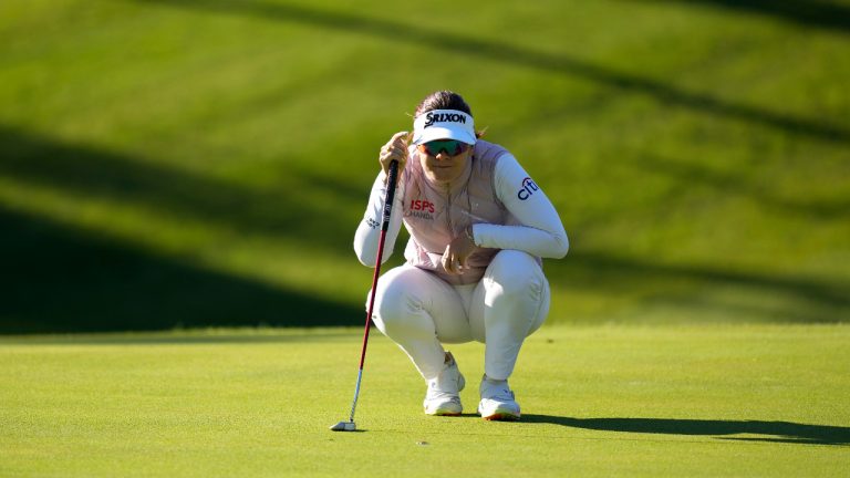 Hannah Green of Australia lines up a putt on the first hole during the third round of the BMW Ladies Championship at LPGA International Busan in Busan, South Korea, Saturday, Oct. 23, 2021. (Lee Jin-man/AP)