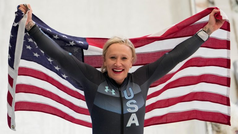 Kaillie Humphries, of the United States, celebrates winning the gold medal in the women's monobob at the 2022 Winter Olympics, Monday, Feb. 14, 2022, in the Yanqing district of Beijing. (Pavel Golovkin/AP Photo)