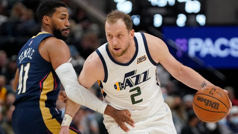 Utah Jazz guard Joe Ingles (2) drives around New Orleans Pelicans forward Garrett Temple (41) the second half of a preseason NBA basketball game Monday, Oct. 11, 2021, in Salt Lake City. (Rick Bowmer/AP)