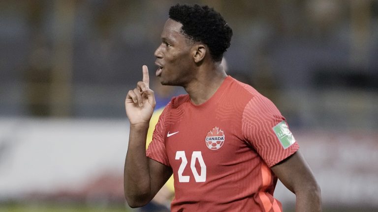 Canada's Jonathan David celebrates scoring his side's 2nd goal against El Salvador during a qualifying soccer match for the FIFA World Cup Qatar 2022 at Cuscatlan stadium. (Moises Castillo/AP)