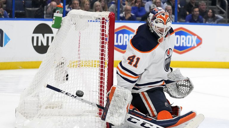 Edmonton Oilers goaltender Mike Smith (41) makes a blocker save on a shot by the Tampa Bay Lightning during the second period of an NHL hockey game. (Chris O'Meara/AP)