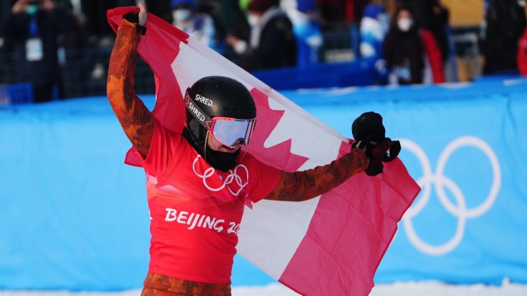 Canada's Meryeta O'Dine celebrates her bronze medal in the women's snowboard cross final at the 2022 Beijing Winter Olympics in Zhangjiakou, China on Wednesday, Feb. 9, 2022. (Sean Kilpatrick/THE CANADIAN PRESS)