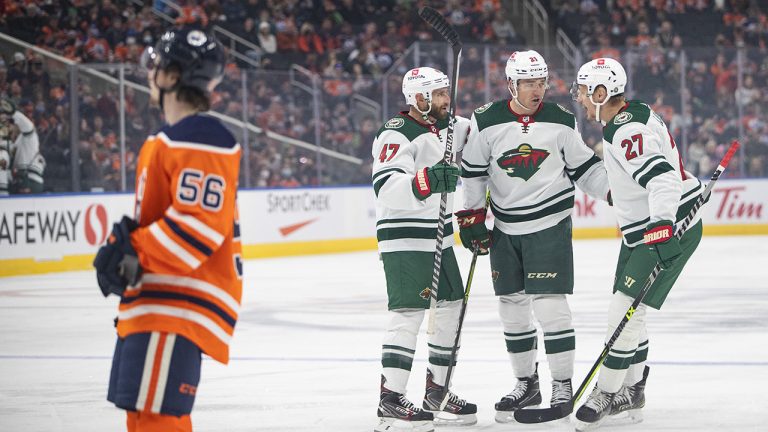 Minnesota Wild's Alex Goligoski (47), Brandon Duhaime (21) and Nick Bjugstad (27) celebrate a goal as Edmonton Oilers' Kailer Yamamoto (56) skates by during first period NHL action. (Jason Franson/CP)