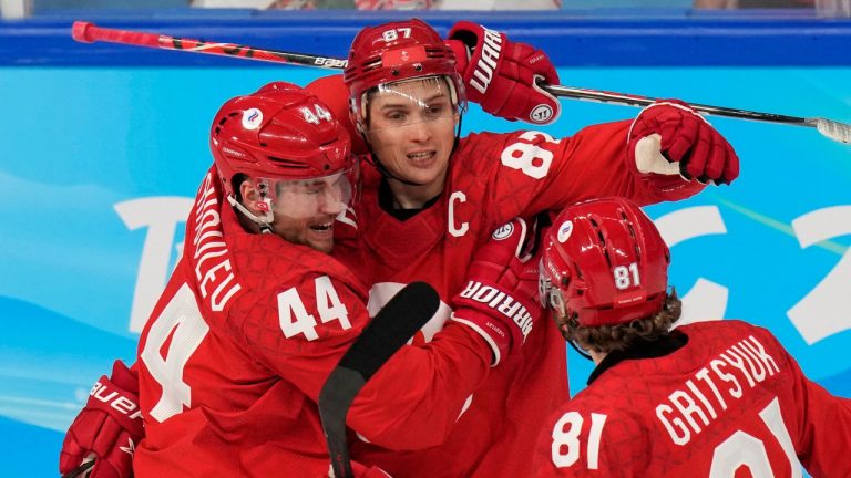 Russian Olympic Committee's Vadim Shipachyov (87) celebrates his goal with teammates during a men's quarterfinal hockey game against Denmark at the 2022 Winter Olympics, Wednesday, Feb. 16, 2022, in Beijing. (Petr David Josek/AP Photo)