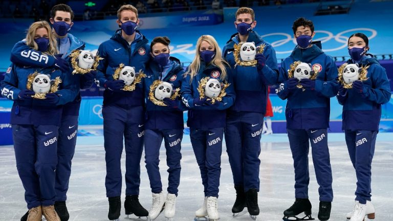 Silver medalists Team United States stand pose for a group photo following the victory ceremony after the team event in the figure skating competition at the 2022 Winter Olympics, Monday, Feb. 7, 2022, in Beijing. (David J. Phillip/AP)