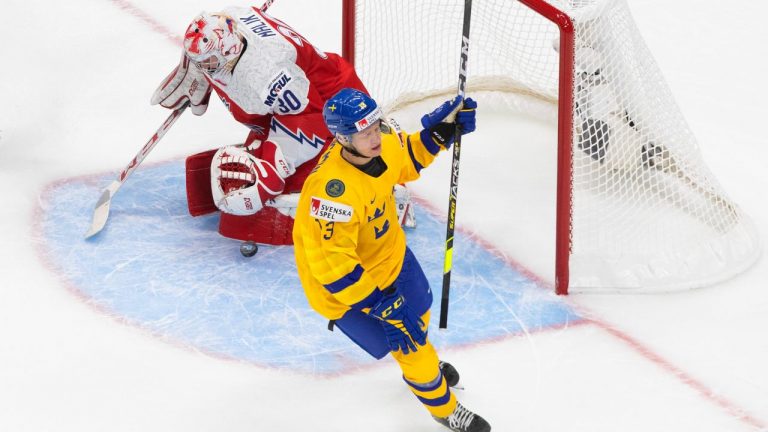 Sweden's Emil Heineman (13) scores on Czech Republic goalie Nick Malik (30) during second period IIHF World Junior Hockey Championship action in Edmonton on Dec. 26, 2020. (Jason Franson/CP)