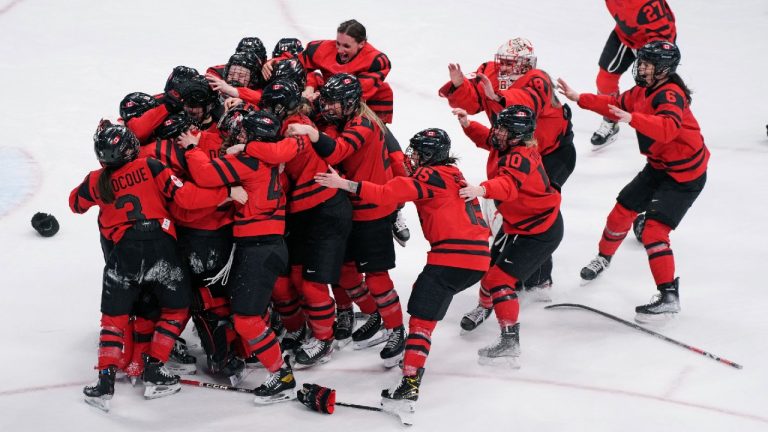 Team Canada celebrates after defeating the United States in women's hockey gold medal game action at the 2022 Winter Olympics in Beijing on Thursday, Feb. 17, 2022. (Paul Chiasson/CP)