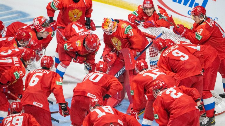 Team Russia gathers around goaltender Askarov Yaroslav
prior to first period against team Sweden during IIHF World Junior Hockey Championship action in Red Deer, Alta., Sunday, Dec. 26, 2021. (Jonathan Hayward/CP)