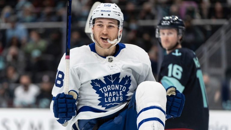 Toronto Maple Leafs left wing Michael Bunting celebrates after scoring a goal during the first period of the team's NHL hockey game against the Seattle Kraken, Monday, Feb. 14, 2022, in Seattle. (Stephen Brashear/AP)