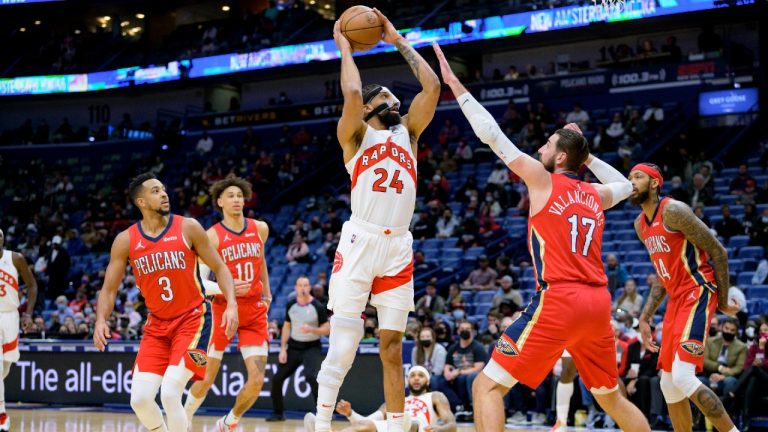 Toronto Raptors center Khem Birch (24) shoots over New Orleans Pelicans center Jonas Valanciunas (17) during the first half of an NBA basketball game in New Orleans, Monday, Feb. 14, 2022. (Matthew Hinton/AP)