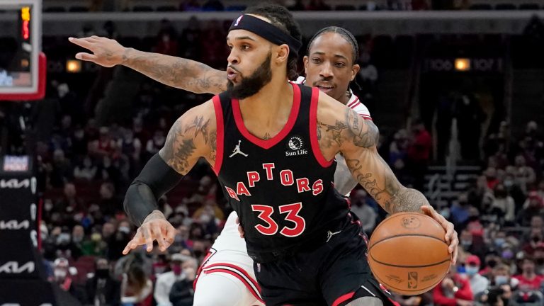 Toronto Raptors' Gary Trent Jr. (33) drives to the basket past Chicago Bulls' DeMar DeRozan during the first half of an NBA basketball game Wednesday, Jan. 26, 2022, in Chicago. (Charles Rex Arbogast/AP)