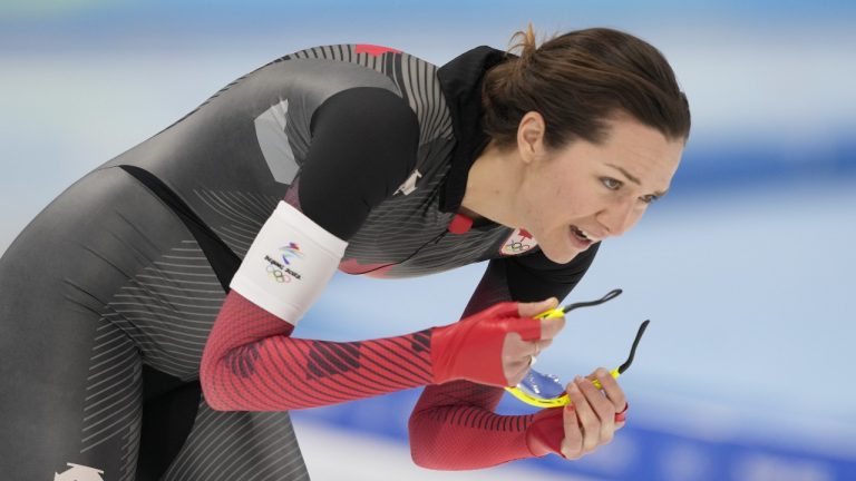 Canada's Isabelle Weidemann cools down after skating during the women's 5,000-metre speedskating final at the Beijing Winter Olympics in Beijing, China, on Thursday, Feb. 10, 2022. (Paul Chiasson/THE CANADIAN PRESS)