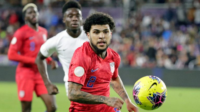 U.S. defender DeAndre Yedlin, right, goes after the ball in front of Canada midfielder Alphonso Davies, center, as forward Gyasi Zardes, left, watches during the second half of a CONCACAF Nations League soccer match Friday, Nov. 15, 2019, in Orlando, Fla. (John Raoux/AP)