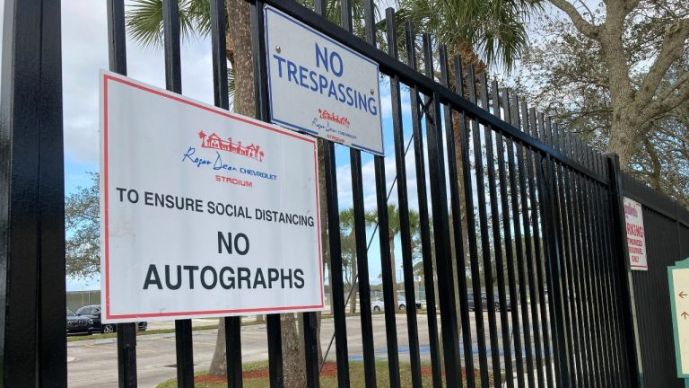 Signs are posted outside Roger Dean Stadium in Jupiter, Fla., Monday, Feb. 21, 2022. Baseball labor negotiations moved to the spring training ballpark from New York as players and owners join the talks, which enter a more intensive phase with perhaps a week left to salvage opening day on March 31. (Ron Blum/AP Photo)