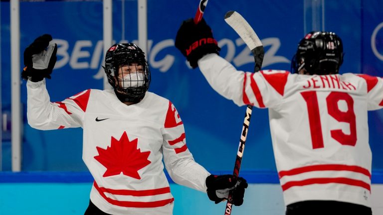 Canada's Sarah Nurse (20) celebrates with Brianne Jenner (19) after scoring a goal against Russian Olympic Committee during a preliminary round women's hockey game at the 2022 Winter Olympics, Monday, Feb. 7, 2022, in Beijing. (Petr David Josek/AP Photo)