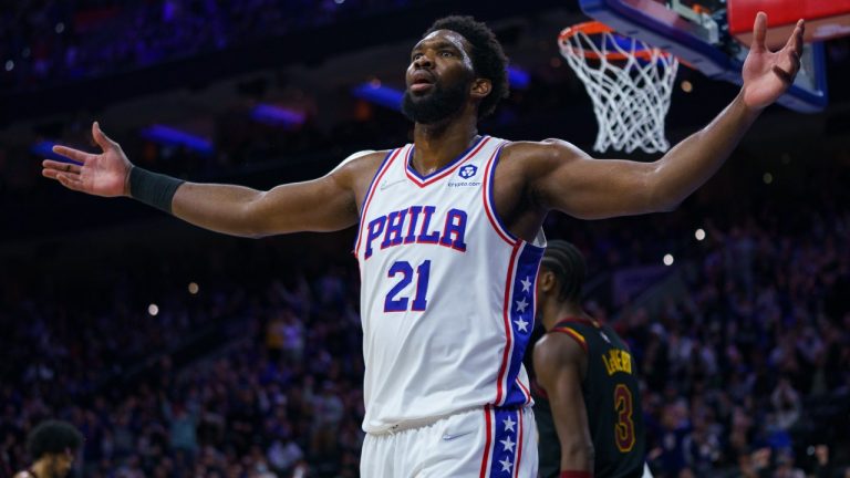 Philadelphia 76ers' Joel Embiid reacts after dunking and getting fouled during the second half of an NBA basketball game against the Cleveland Cavaliers, Saturday, Feb. 12, 2022, in Philadelphia. (Chris Szagola/AP)