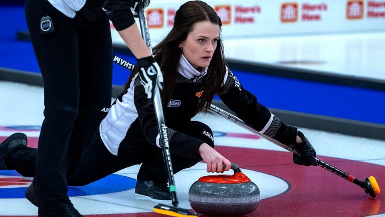 Wild Card 1 skip Tracy Fleury delivers a rock as they play Northern Ontario at the Scotties Tournament of Hearts at Fort William Gardens in Thunder Bay, Ont., Thursday, Feb. 3, 2022. This is Fleury's first appearance at the championships after being sidelined in COVID-19 protocol. (Andrew Vaughan/CP)