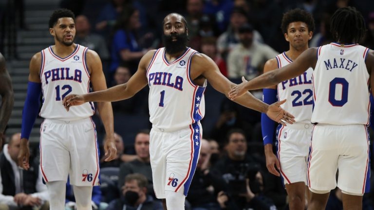 Philadelphia 76ers guard James Harden (1) slaps hands with guard Tyrese Maxey (0) during the first half of the team's NBA basketball game against the Minnesota Timberwolves, Friday, Feb. 25, 2022, in Minneapolis. (Stacy Bengs/AP)