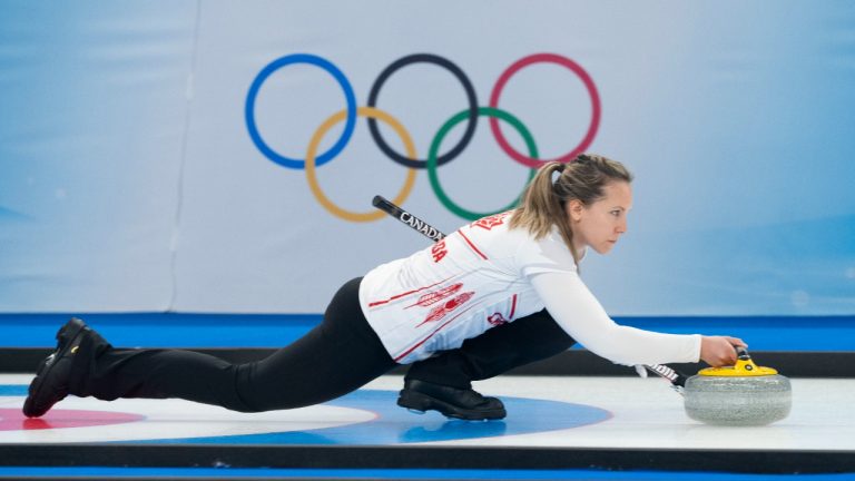 Canada’s Rachel Homan delivers a rock as they face Great Britain's Bruce Mouat and Jennifer Dodds in mixed doubles curling play at the 2022 Winter Olympics in Beijing on Thursday, February 3, 2022. (Paul Chiasson/CP)