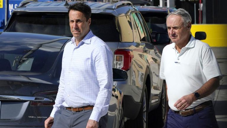 Major League Baseball Deputy Commissioner Dan Halem, left, and Commissioner Rob Manfred, right, walk after negotiations with the players association in an attempt to reach an agreement to salvage March 31 openers and a 162-game season. (Lynne Sladky/AP)