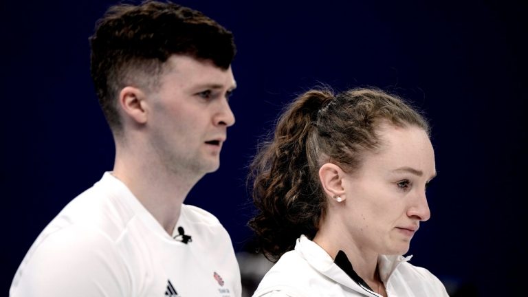 Great Britain's Jennifer Dodds, right, and Bruce Mouat, compete in a mixed doubles curling match against Sweden at the 2022 Winter Olympics, Wednesday, Feb. 2, 2022, in Beijing. (Nariman El-Mofty/AP Photo)