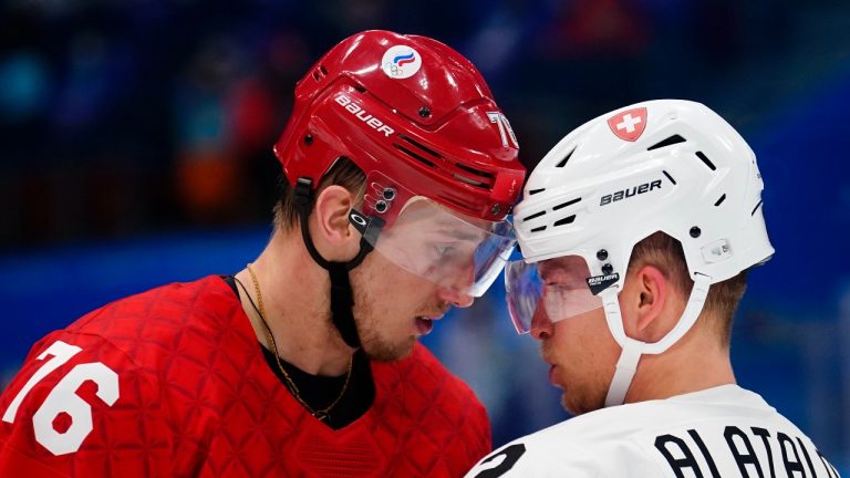 Russian Olympic Committee's Andrei Chibisov (76) and Switzerland's Santeri Alatalo (2) have words during a preliminary round men's hockey game at the 2022 Winter Olympics, Wednesday, Feb. 9, 2022, in Beijing. (Matt Slocum/AP Photo)