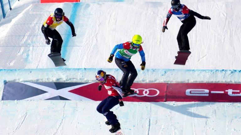 From left: Belle Brockhoff of Australia, Eva Samkova of the Czech Republic, Michela Moioli of Italy, and Stacy Gaskill of the United States compete during a semifinal of women's snowboard cross at the FIS Snowboard Cross World Cup, a test event for the 2022 Winter Olympics, at the Genting Resort Secret Garden in Zhangjiakou in northern China's Hebei Province in November 2021. (Mark Schiefelbein/AP)