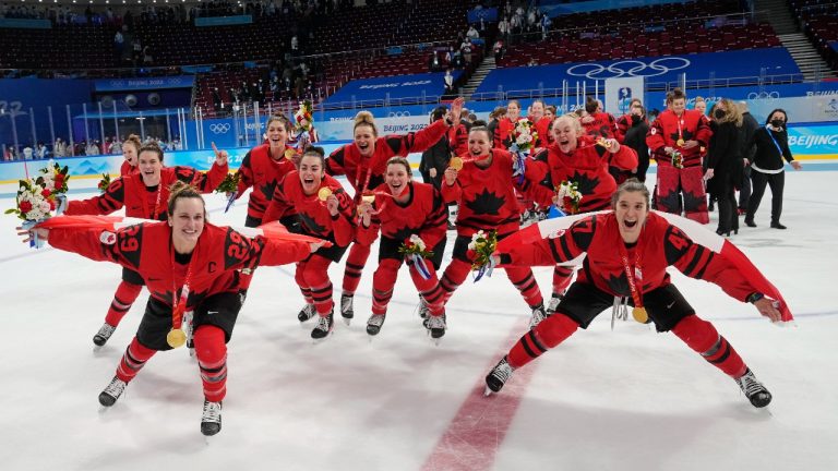 Team Canada celebrates with their gold medals after defeating the United States in women's hockey gold medal game action at the 2022 Winter Olympics in Beijing on Thursday, Feb. 17, 2022. (Ryan Remiorz/THE CANADIAN PRESS)