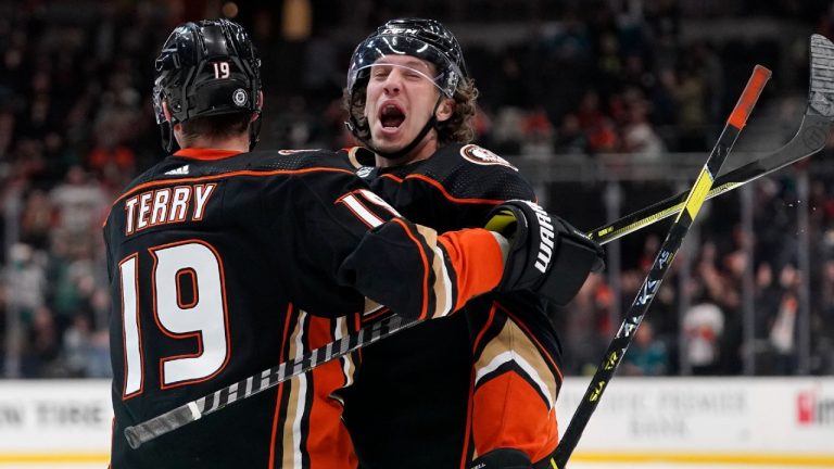 Anaheim Ducks left wing Rickard Rakell, right, celebrates his game-winning goal with Troy Terry during overtime of an NHL hockey game against the San Jose Sharks Sunday, March 6, 2022, in Anaheim, Calif. (Mark J. Terrill/AP)