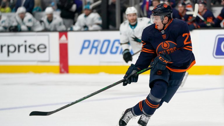 Edmonton Oilers defenceman Tyson Barrie reaches for the puck during the first period of the team's NHL hockey game against the San Jose Sharks in San Jose, Calif., Monday, Feb. 14, 2022. (Jeff Chiu/AP)