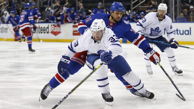 New York Rangers' Ryan Reaves (75) defends against Toronto Maple Leafs' Alex Biega (33) during the second period of an NHL hockey game. (John Munson/AP)