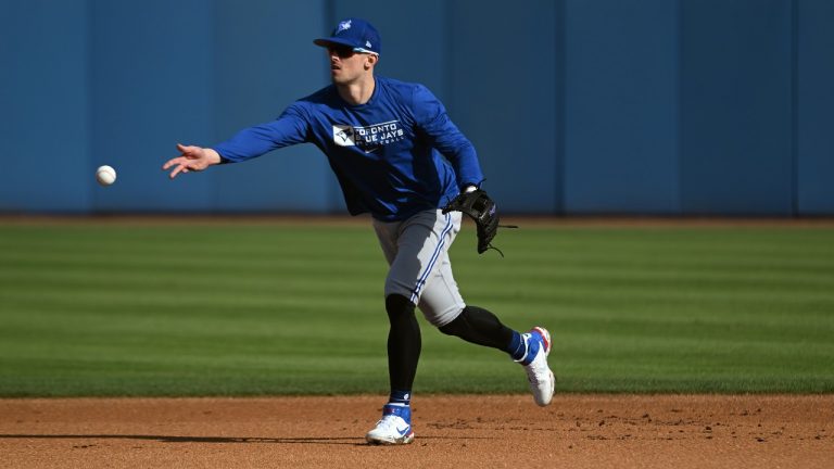 Toronto Blue Jays infielder Cavan Biggio fields a ground ball during a spring training workout Monday, March 14, 2022, in Dunedin, Fla. (Steve Nesius/THE CANADIAN PRESS)