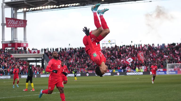 Canada's Tajon Buchanan does a backflip after scoring against Jamaica during first half CONCACAF World Cup soccer qualifying action in Toronto. (Nathan Denette/CP)