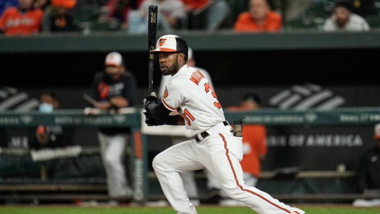 Baltimore Orioles' Cedric Mullins watches his ball as he hits a double against the Boston Red Sox. (Julio Cortez/AP)